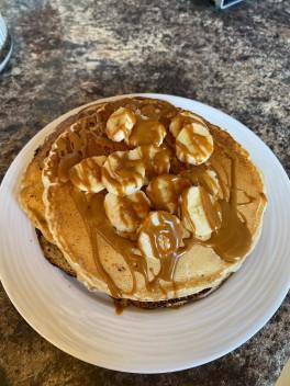 Stack of AquaQ Pancakes topped with Banana and Syrup